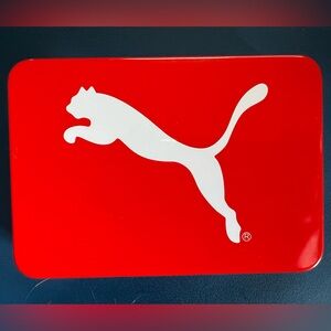 Puma brand tin with white emblem & red background, silver interior